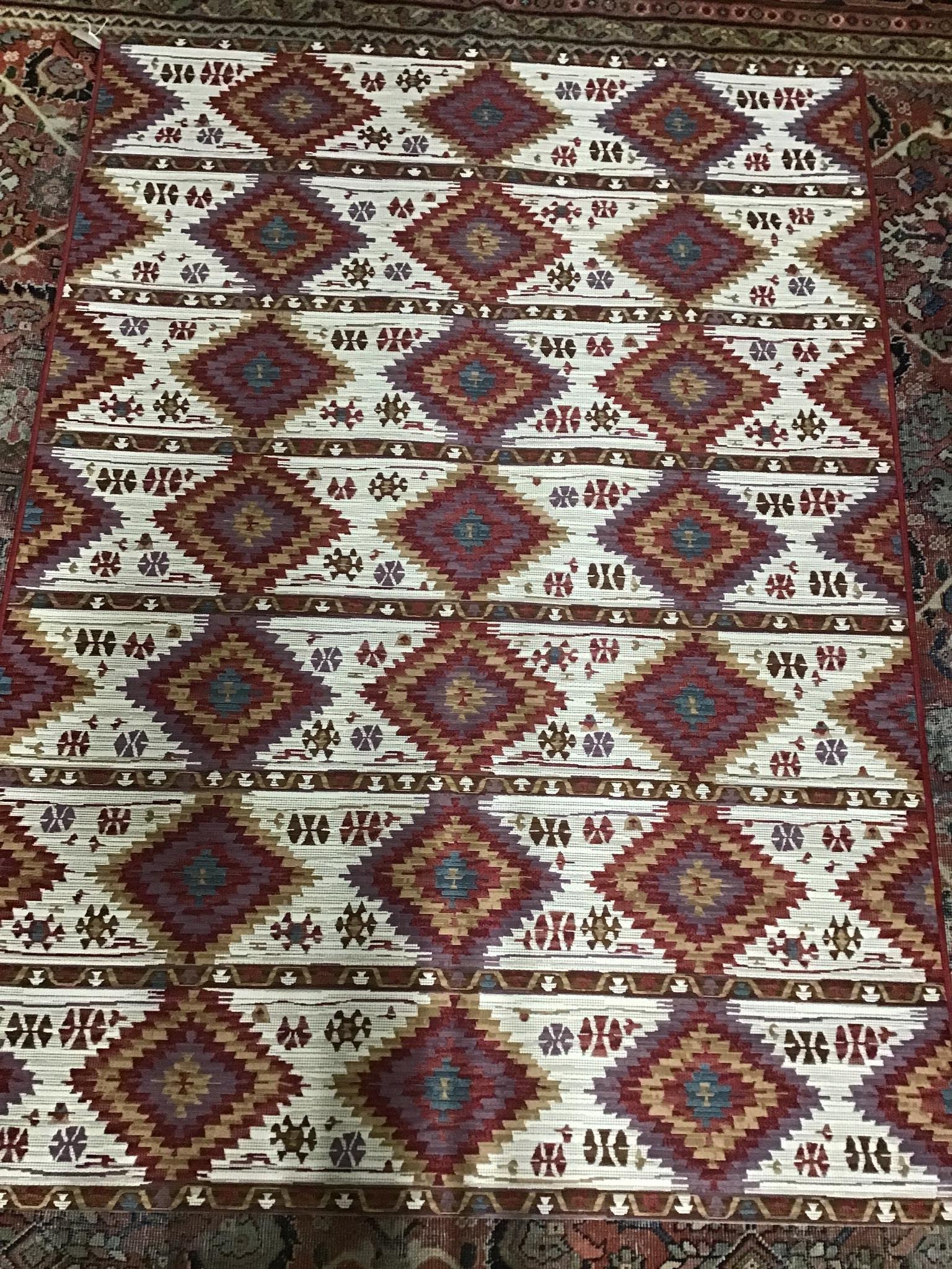 A modern Kilim style polychrome rug, 220cms x 150cms